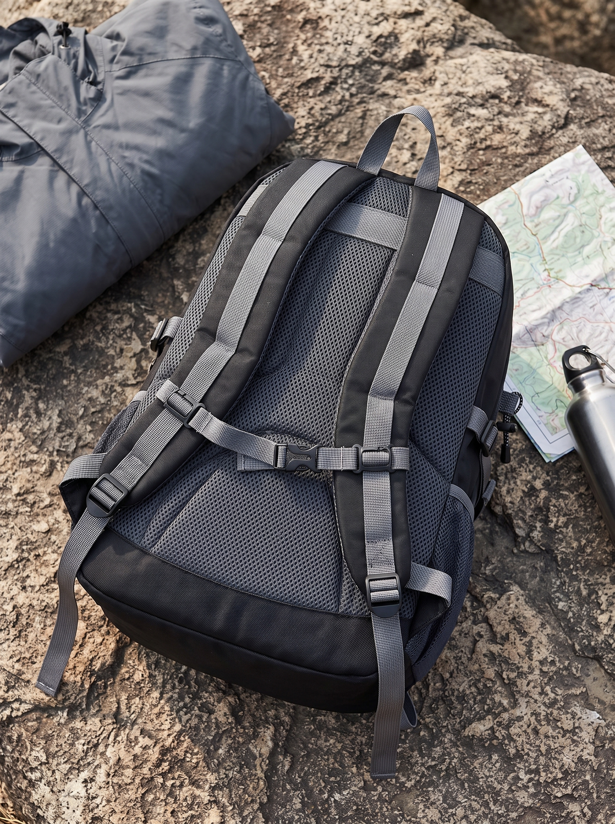 Odyssey backpack top down view showing reinforced base and compression straps