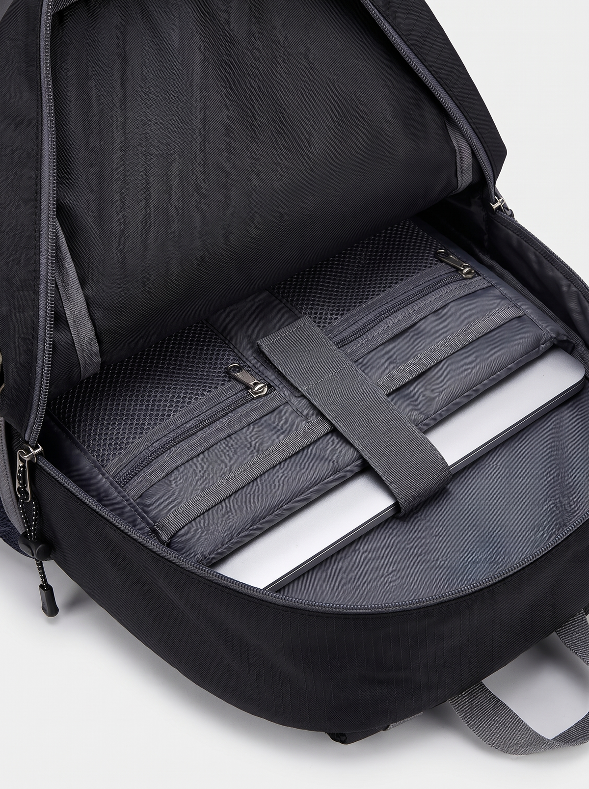 Odyssey backpack internal compartments and waterproof material close up